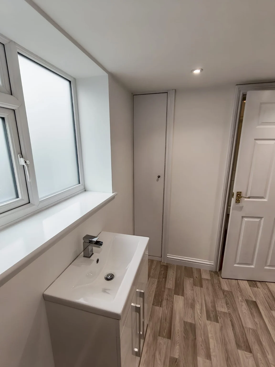 Vanity unit and window beside finished joinery in the Wellesbourne shower room