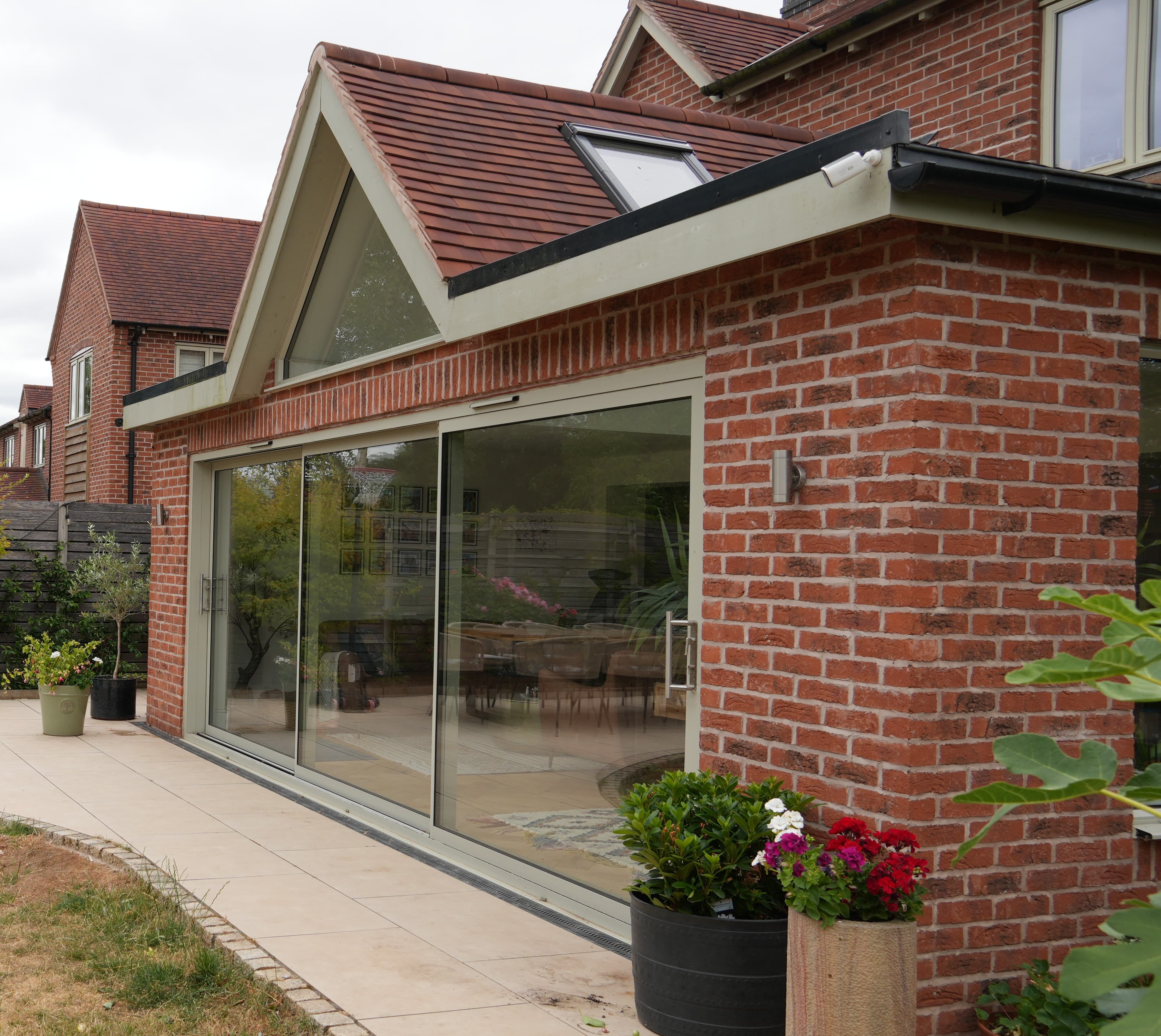 Completed brick extension with large glazed doors and refined finish